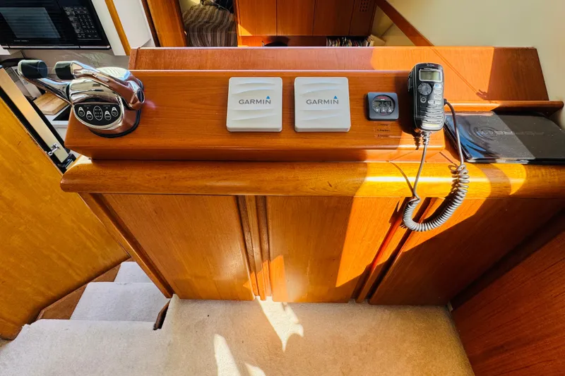 Slide: The Image of Control panel of a 1991 Californian 55 Cockpit Motor Yacht with Garmin navigation equipment. - 78