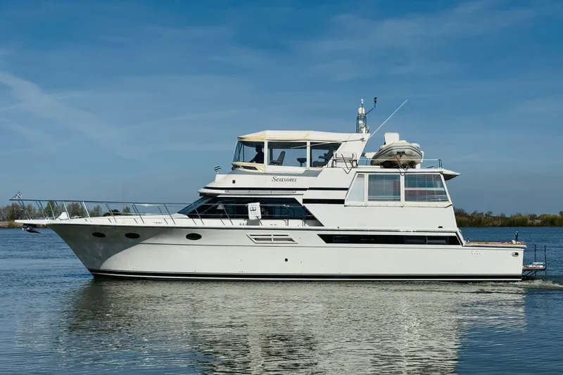 Slide: The Image of 1991 Californian 55 Cockpit Motor Yacht cruising on calm waters under clear skies. - 8
