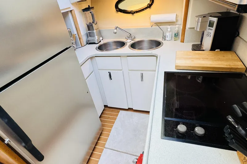 Slide: The Image of Kitchen area of 1991 Californian 55 Cockpit Motor Yacht with modern appliances. - 84