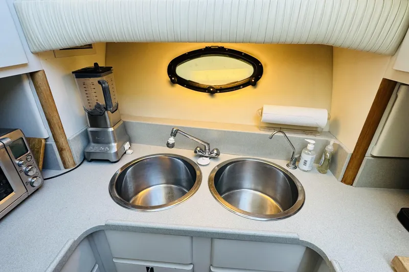 Slide: The Image of 1991 Californian 55 Cockpit Motor Yacht kitchen with dual sinks and appliances. - 85