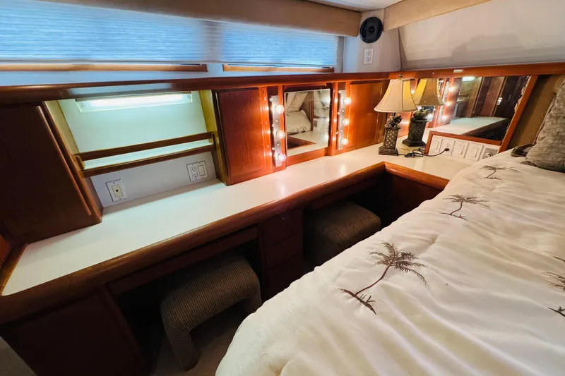 Slide: The Image of Luxurious 1991 Californian 55 Cockpit Motor Yacht bedroom with vanity and elegant lighting. - 92