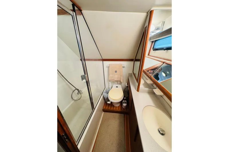 Slide: The Image of Bathroom interior of 1991 Californian 55 Cockpit Motor Yacht with shower and sink. - 97