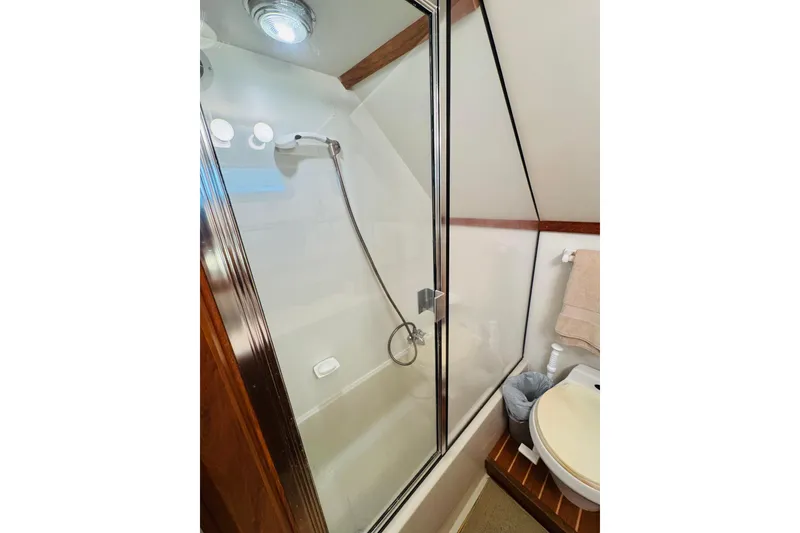 Slide: The Image of Bathroom of 1991 Californian 55 Cockpit Motor Yacht with shower and toilet. - 98