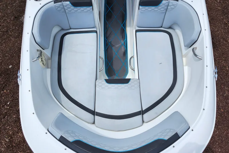 Slide: The Image of 2023 Bayliner Element M17 boat interior with gray seating and blue accents. - 10