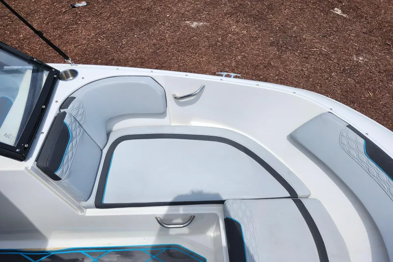 Slide: The Image of 2023 Bayliner Element M17 boat interior with cushioned seating and modern design. - 13