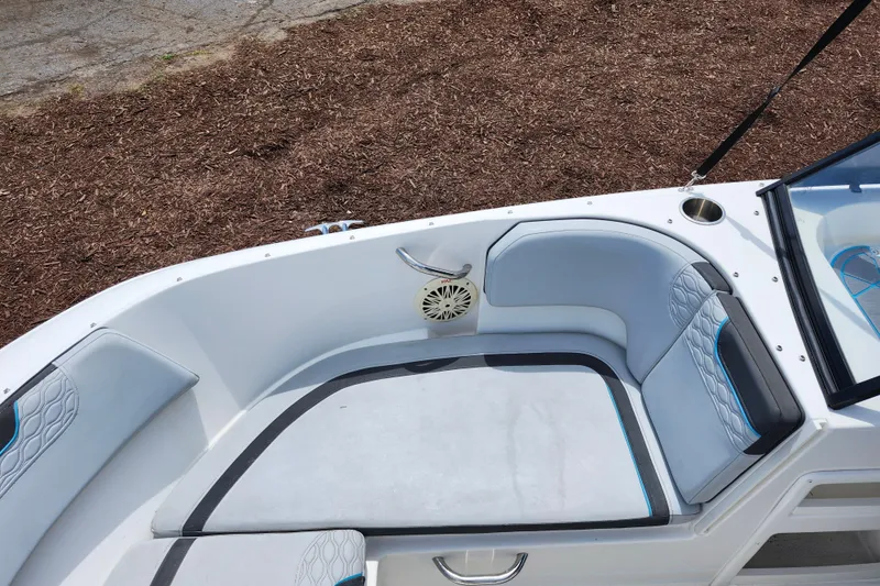 Slide: The Image of 2023 Bayliner Element M17 boat interior with cushioned seating and speaker. - 14