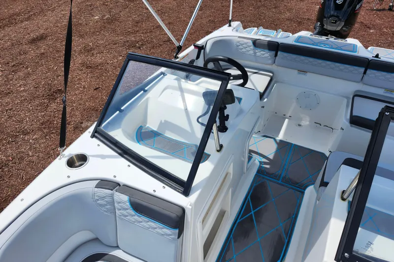 Slide: The Image of 2023 Bayliner Element M17 boat interior with modern seating and steering console. - 15