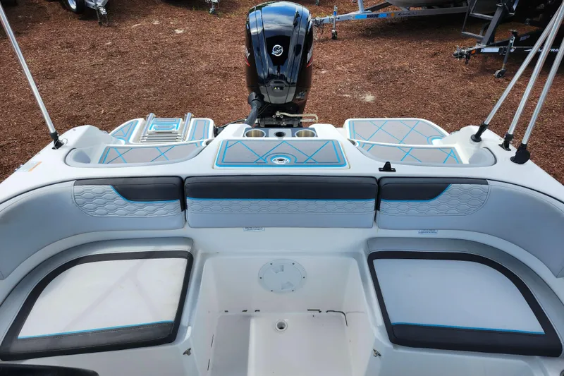 Slide: The Image of 2023 Bayliner Element M17 boat interior with seating and motor view. - 17