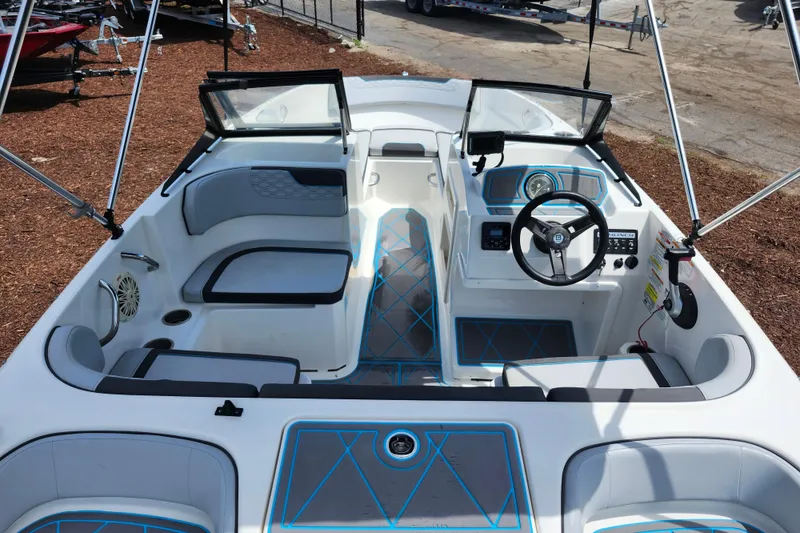 Slide: The Image of 2023 Bayliner Element M17 boat interior with seating and steering console. - 27
