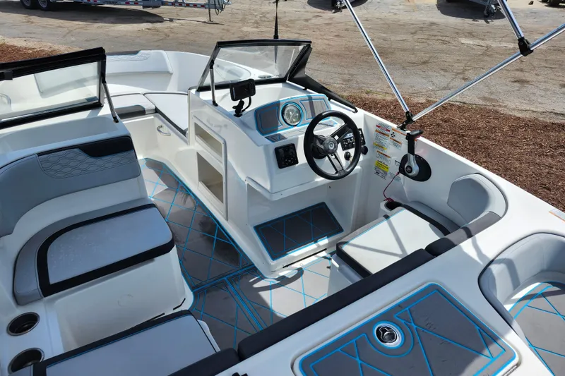 Slide: The Image of 2023 Bayliner Element M17 boat interior with modern seating and steering console. - 28