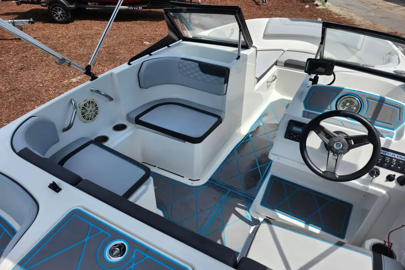 Slide: The Image of 2023 Bayliner Element M17 boat interior with modern seating and steering console. - 29