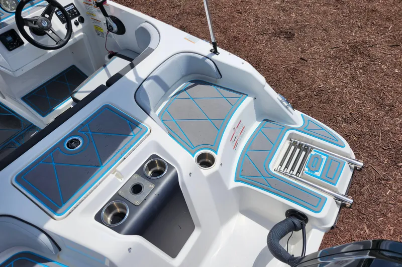 Slide: The Image of 2023 Bayliner Element M17 boat interior with seating and cup holders. - 31