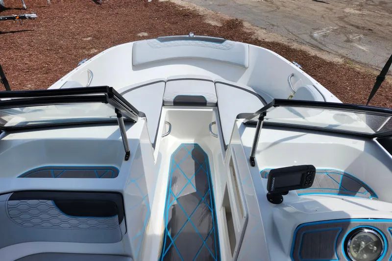 Slide: The Image of 2023 Bayliner Element M17 boat interior with modern seating and navigation equipment. - 32