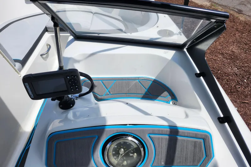 Slide: The Image of 2023 Bayliner Element M17 boat interior with navigation equipment and stylish dashboard design. - 36