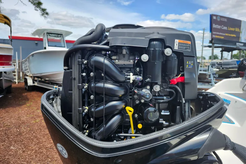 Slide: The Image of 2023 Bayliner Element M17 engine displayed at a boat dealership. - 37