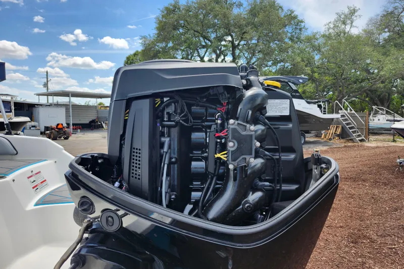 Slide: The Image of 2023 Bayliner Element M17 outboard engine, detailed view, in a sunny outdoor setting. - 38