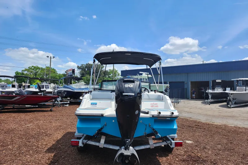 Slide: The Image of 2023 Bayliner Element M17 boat displayed outdoors under a clear blue sky. - 6