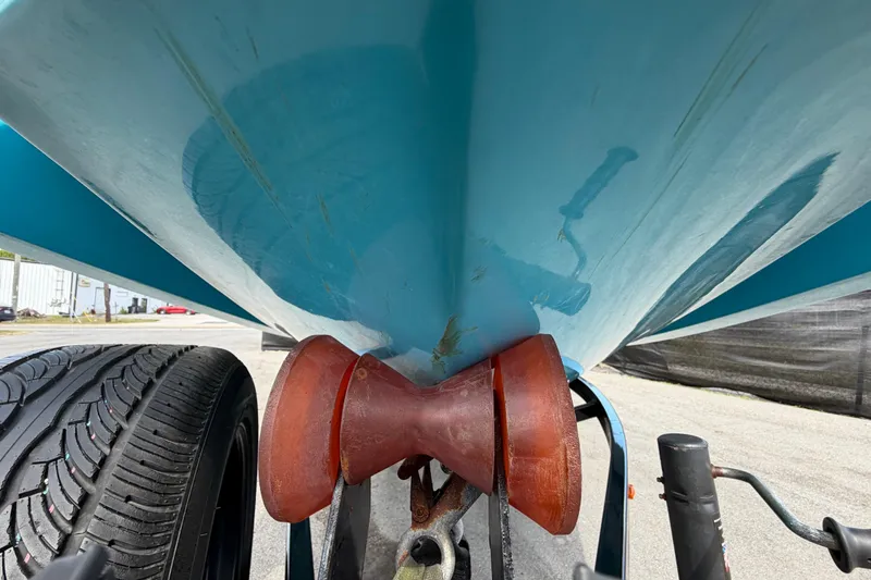 Slide: The Image of Close-up of 2023 Heyday WTSurf boat hull on trailer with tire visible. - 13