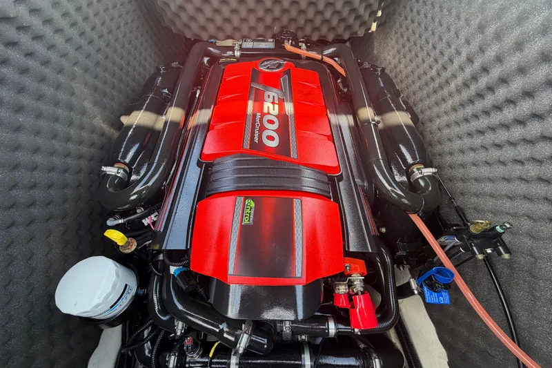 Slide: The Image of 2023 Heyday WTSurf boat interior with gray seating and blue accents under a clear sky. - 39