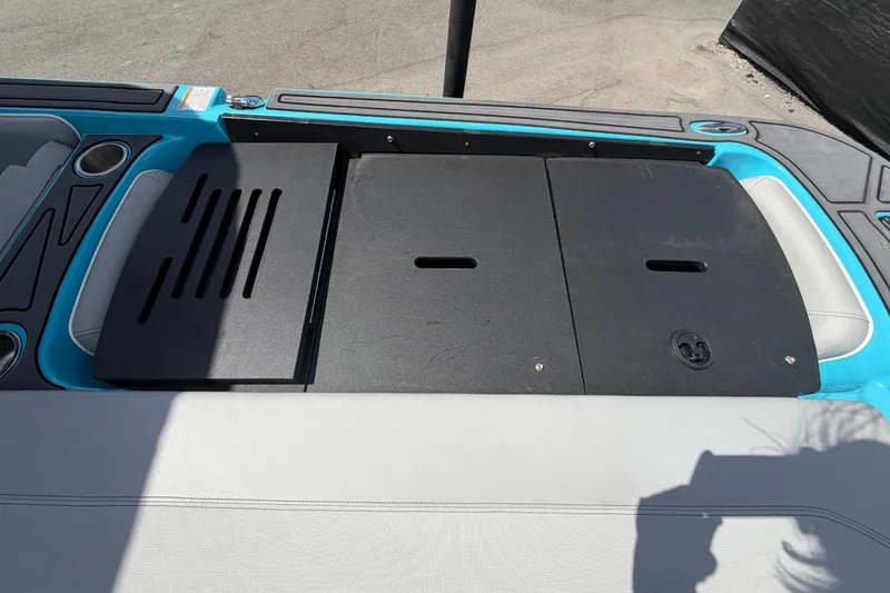 Slide: The Image of Interior of 2023 Heyday WTSurf boat with blue and gray seating. - 47