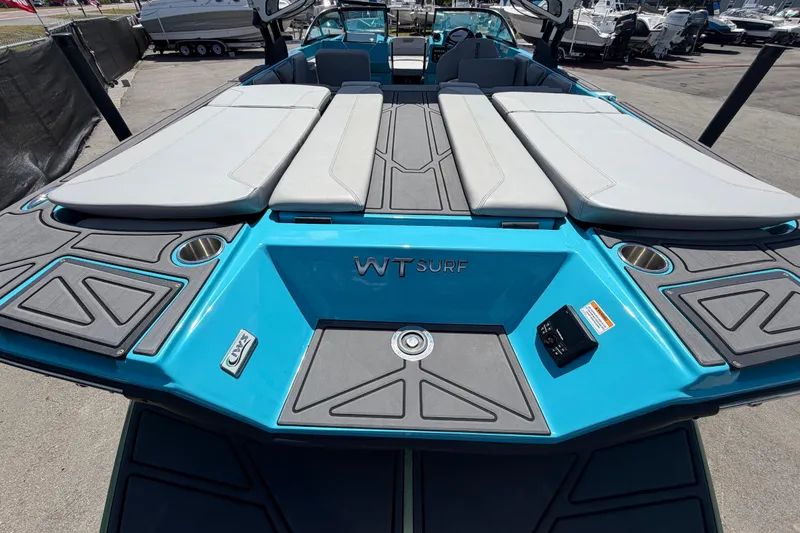 Slide: The Image of 2023 Heyday WTSurf boat with sleek design, showcased outdoors under a clear sky. - 57