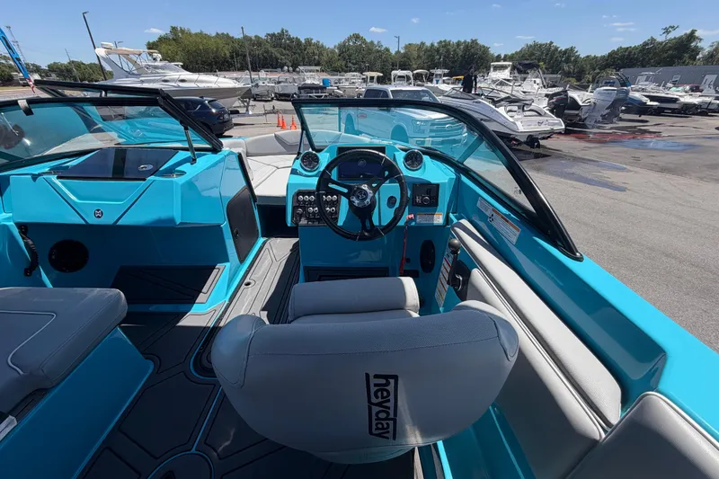 Slide: The Image of 2023 Heyday WTSurf boat dashboard with steering wheel and control panel. - 64
