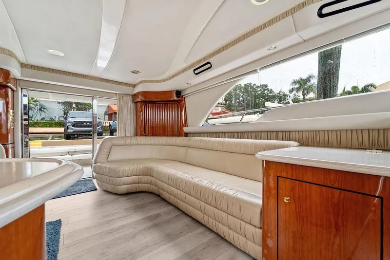 Slide: The Image of Luxurious interior of a 2000 Sea Ray 560 Sedan Bridge yacht with plush seating. - 17