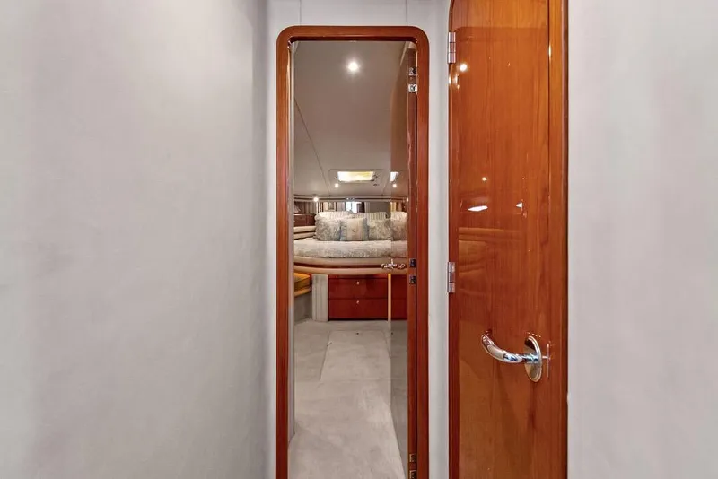 Slide: The Image of Interior view of 2000 Sea Ray 560 Sedan Bridge yacht cabin with wooden door. - 21