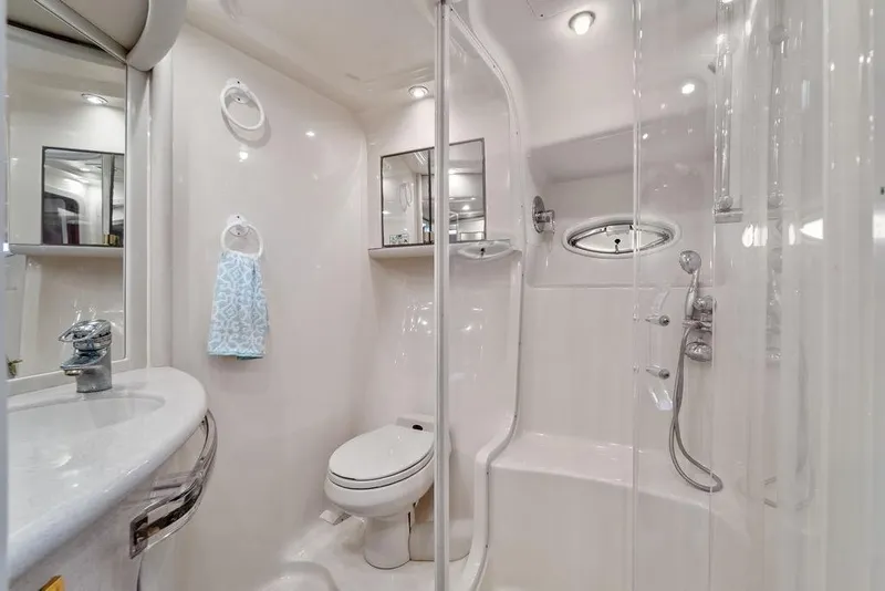 Slide: The Image of Luxurious bathroom in 2000 Sea Ray 560 Sedan Bridge yacht, featuring modern fixtures and elegant design. - 27