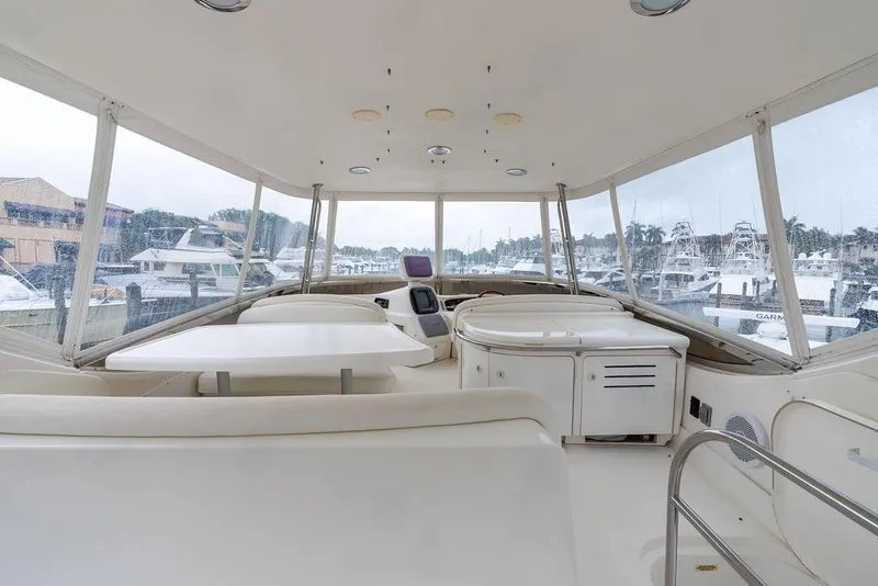 Slide: The Image of Interior view of 2000 Sea Ray 560 Sedan Bridge yacht with seating and table. - 28