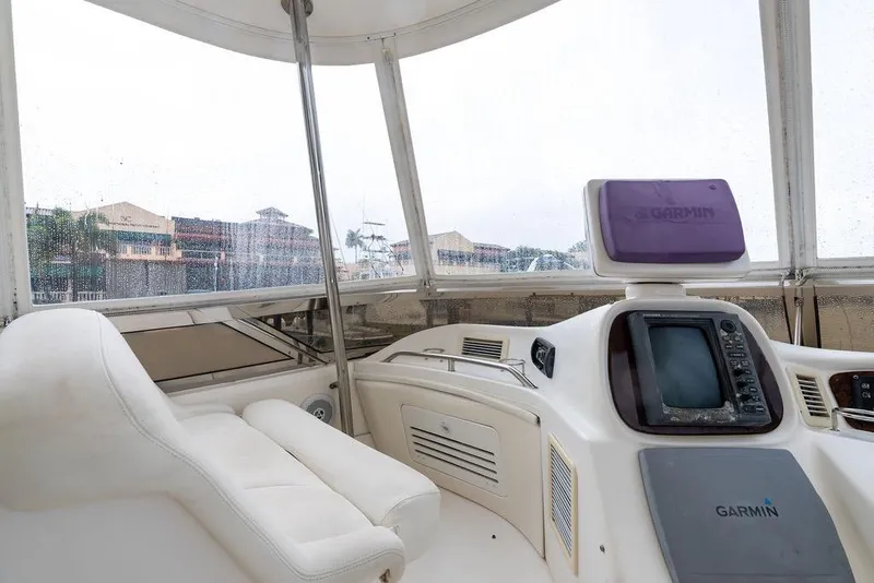 Slide: The Image of Interior view of 2000 Sea Ray 560 Sedan Bridge yacht with Garmin navigation system. - 32