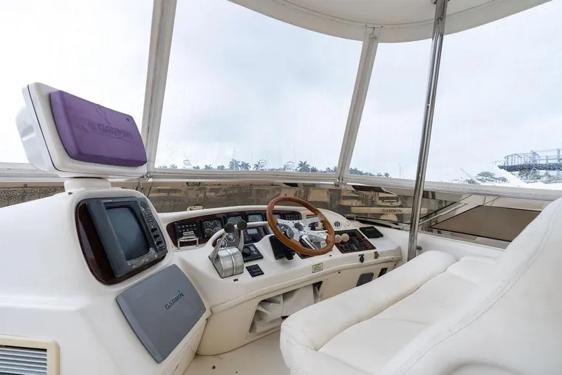 Slide: The Image of Interior view of 2000 Sea Ray 560 Sedan Bridge yacht cockpit with navigation equipment. - 33