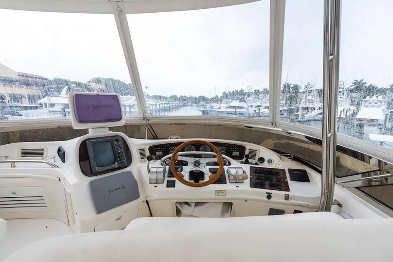Slide: The Image of Cockpit view of 2000 Sea Ray 560 Sedan Bridge yacht with navigation equipment. - 34