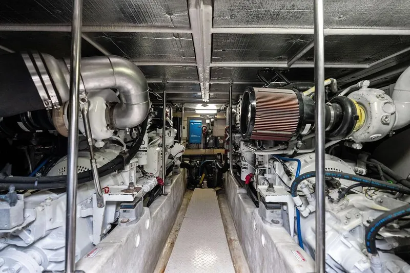 Slide: The Image of Engine room of a 2000 Sea Ray 560 Sedan Bridge yacht, showcasing dual engines. - 41