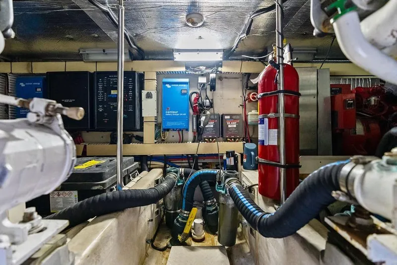 Slide: The Image of Engine room of a 2000 Sea Ray 560 Sedan Bridge with equipment and fire extinguisher. - 42