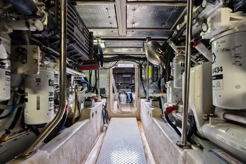 Slide: The Image of Engine room of a 2000 Sea Ray 560 Sedan Bridge yacht, showcasing mechanical components. - 43