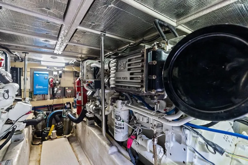 Slide: The Image of Engine room of 2000 Sea Ray 560 Sedan Bridge with CAT marine power system. - 45