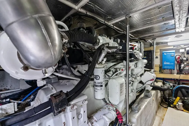 Slide: The Image of Engine room of a 2000 Sea Ray 560 Sedan Bridge yacht, showcasing mechanical components. - 46