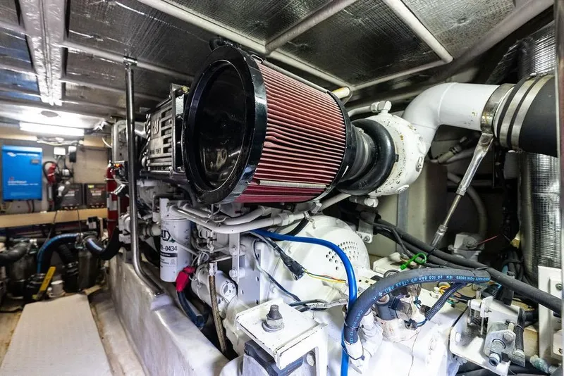 Slide: The Image of Engine room of a 2000 Sea Ray 560 Sedan Bridge yacht, showcasing mechanical components. - 48