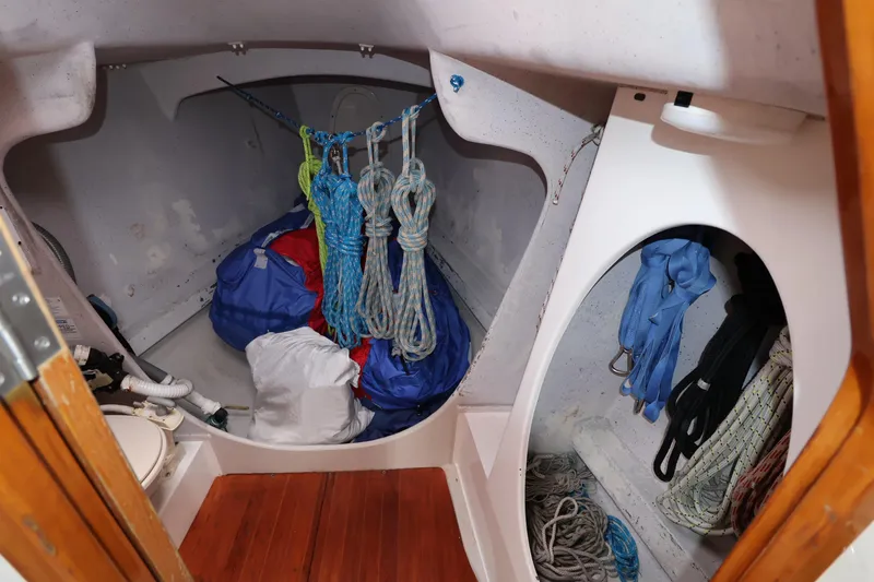 Slide: The Image of Storage area in a 2000 Sydney 38 sailboat with ropes and gear. - 34