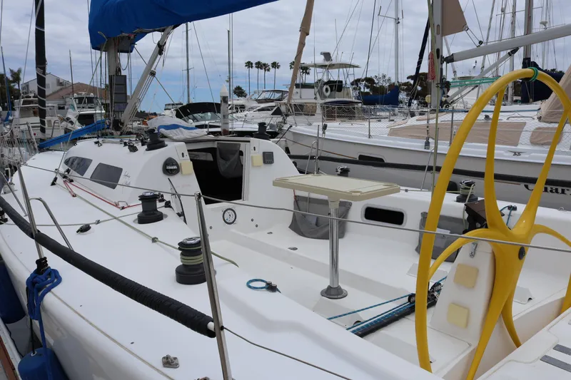 Slide: The Image of Sailboat docked in marina, Sydney 38 model, year 2000, with blue sail cover. - 7