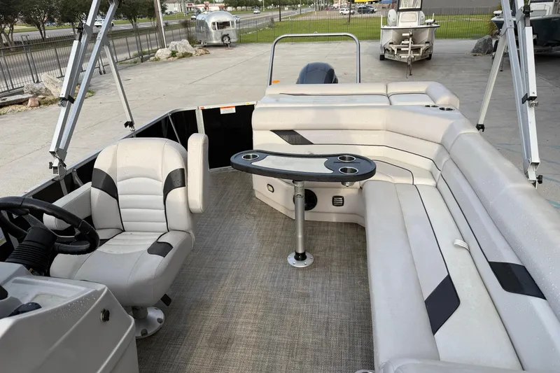 Slide: The Image of 2022 Custom G3 Suncatcher 322FC pontoon boat interior with seating and table. - 11