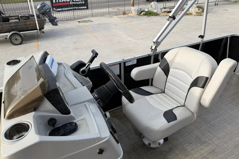 Slide: The Image of Captain's chair and console of 2022 Custom G3 Suncatcher 322FC boat. - 12