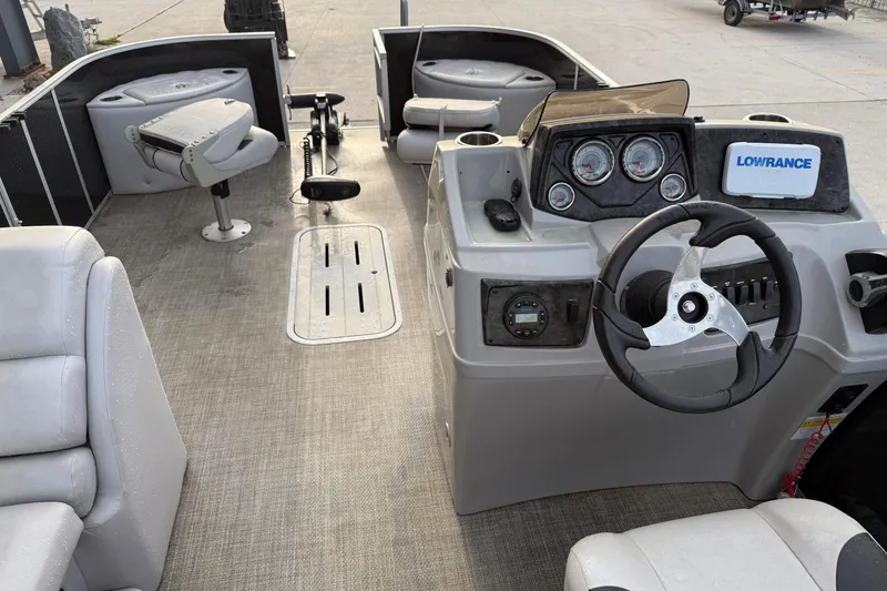 Slide: The Image of 2022 Custom G3 Suncatcher 322FC boat interior with steering console and seating. - 14
