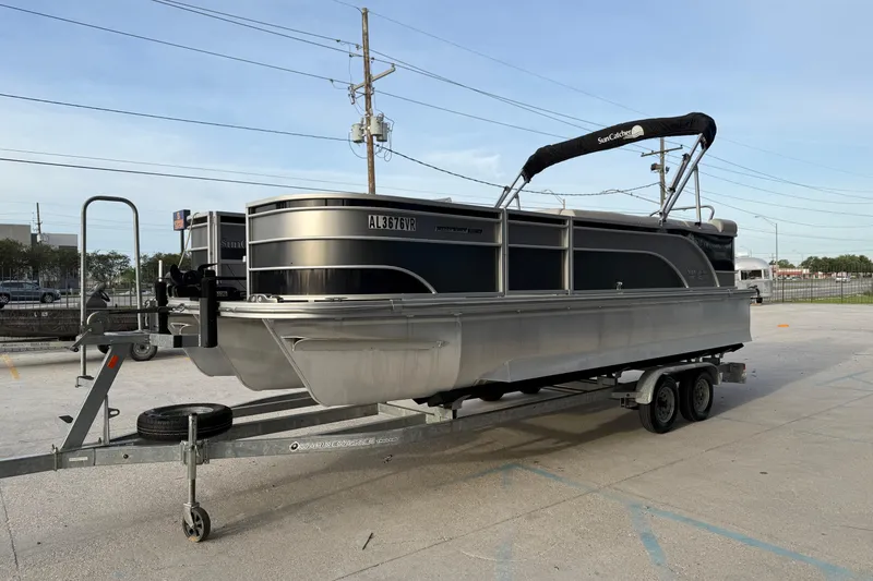Slide: The Image of 2022 Custom G3 Suncatcher 322FC pontoon boat on trailer in parking lot. - 7