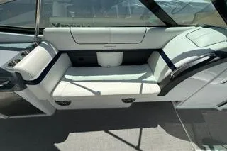 Slide: The Image of 2015 Formula 350 Crossover Bowrider, white bow seating area, docked on concrete surface. - 18