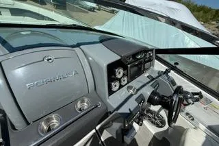 Slide: The Image of 2015 Formula 350 Crossover Bowrider interior with sleek white seating and modern design. - 20