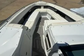 Slide: The Image of Interior view of a 2015 Formula 350 Crossover Bowrider, featuring seating and cabinetry. - 21