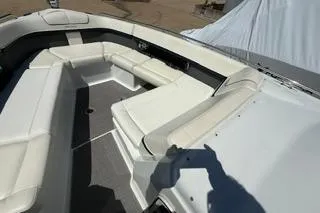 Slide: The Image of 2015 Formula 350 Crossover Bowrider interior kitchen with sink, microwave, and cabinetry. - 22