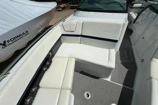 Slide: The Image of Interior of 2015 Formula 350 Crossover Bowrider with beige seating and wooden steps. - 24